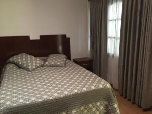 Ένα ή περισσότερα κρεβάτια σε δωμάτιο στο Como en tu casa