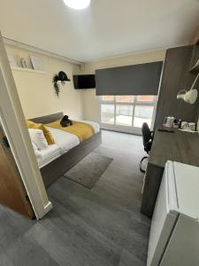 a bedroom with a bed and a large window at west walk house in Nottingham