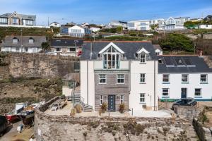 an aerial view of a large white house at Harbour Master's House in Portreath