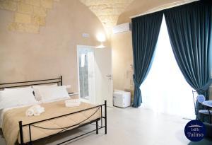 Postel nebo postele na pokoji v ubytování B&B Talino