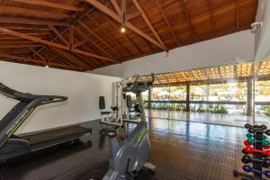 an exercise room with a treadmill and a gym at Hotel Fazenda Brisa Itu in Itu