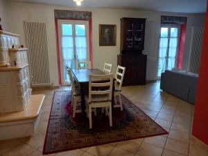 a dining room with a table and chairs at b&b isoladelsole in Perledo