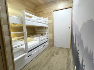 Posteľ alebo postele v izbe v ubytovaní LE NID