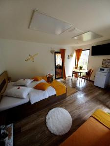 a bedroom with a large bed with a white rug at The Sun Chalet by Touch the Sky in Moieciu de Jos