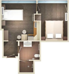a floor plan of a small room with brown at Elite Pension in Štúrovo