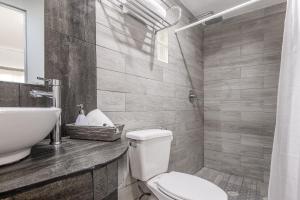 a bathroom with a toilet and a sink at Hotel La Colección, Universidad de Guanajuato, Centro in Guanajuato