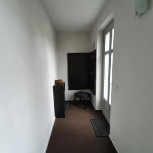 a room with a large flat screen tv on a wall at Ferienapartment Lilo in Eisenhüttenstadt +2 photos