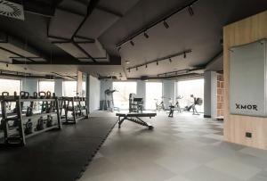 a gym with a group of people exercising in it at Apartament Gdańsk Premium Porto in Gdańsk