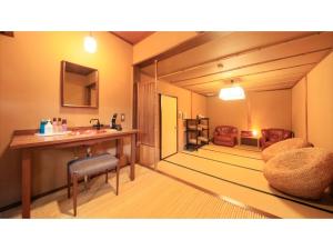 a bathroom with a sink and a table and chairs at Saikatei Jidaiya - Vacation STAY 96452v in Kaminoyama +24 photos