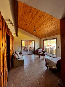 a living room with a couch and a table at Ruka Pucón Hostel in Pucón