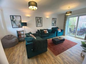 a living room with a couch and a table at St Dunstan's Hideaway in Canterbury