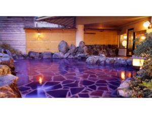 a pool of water with rocks and lights at KONOHANA NO IORI - Vacation STAY 15340v in Mimasaka
