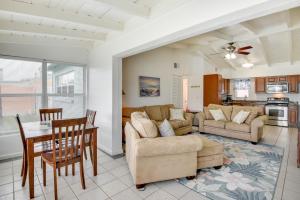 a living room with a couch and a table at Ormond Beach Vacation Rental - Walk to Ocean! in Ormond Beach