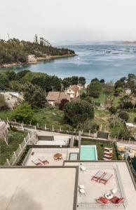 a view of the water from a house at INSUA BEACH HOUSE in Pontevedra