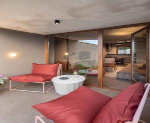 a living room with a couch and a table at INSUA BEACH HOUSE in Pontevedra