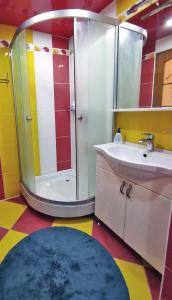 a bathroom with a shower and a sink at Квартира на Пентагоне in Bender