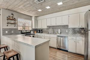 a kitchen with white cabinets and a counter top at Full Moon Harbor in Horseshoe Bay