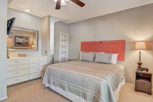 a bedroom with a large bed with a red headboard at Full Moon Harbor in Horseshoe Bay