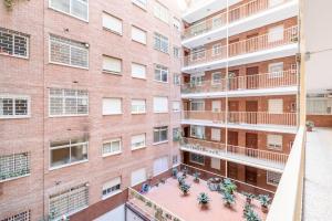 an overhead view of an apartment building with a courtyard at Modern Apartment close to the city center and Alhambra in Granada