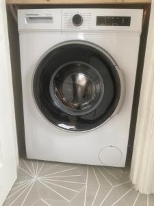 a white washing machine sitting in a room at Ard Alainn Lodge, Adorable Setting, scenic views in Grange