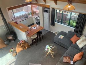 an overhead view of a living room and kitchen in a tiny house at Ridley Manor in Ohakune +24 photos