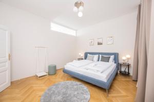 Łóżko lub łóżka w pokoju w obiekcie Luxury Suites Liechtenstein