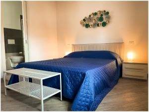 A bed or beds in a room at Casa Larentu