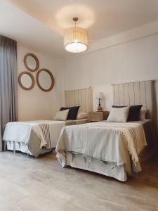 Ένα ή περισσότερα κρεβάτια σε δωμάτιο στο Suites Salta