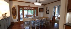 a kitchen and dining room with a table and chairs at Downtown Lake Geneva Home! Walk 2 Everything! in Lake Geneva