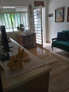 a living room with a table with toys on it at Cantinho do Sossego in Águas de Lindoia