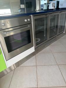 a kitchen with a stainless steel oven in a kitchen at Zentala in Port Lincoln