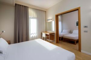 En eller flere senge i et værelse på Best Western Plus Hotel Bologna