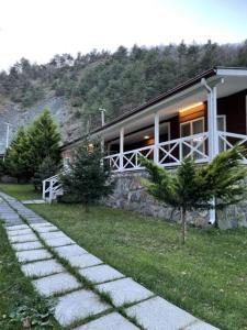 a house with a pathway in front of it at Feel & Live Hotel Villas Restaurant Sapanca in Sakarya