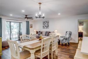 a dining room and living room with a table and chairs at Beckenham 209 in Hilton Head Island