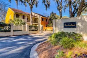 a house with a sign in front of a driveway at Beckenham 209 in Hilton Head Island