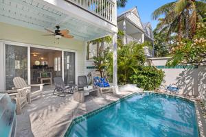 a swimming pool in the backyard of a house at Palm Villa in Duck Key