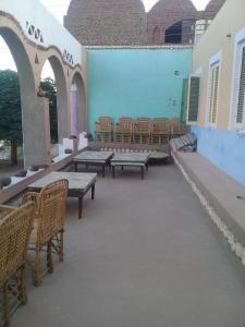 a row of benches and tables in a building at Omay ka in Aswan