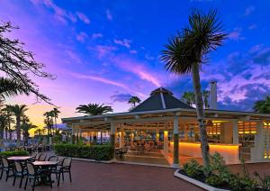 
a hotel room with a patio with palm trees at H10 Las Palmeras in Playa de las Americas
