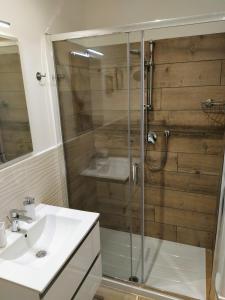 a bathroom with a shower and a sink at La Residenza di Campagna in Manciano