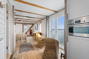 a living room with a view of the ocean at Sveggvika Guesthouse in Averoy