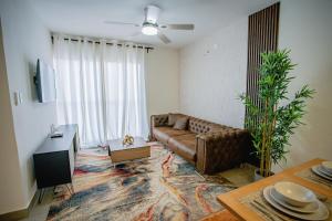 Posezení v ubytování Apartamento con piscina de 3 habitaciones Bávaro