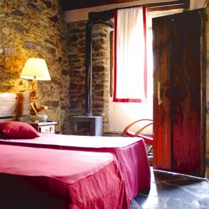 Postel nebo postele na pokoji v ubytování Casa Rural La Ortiga