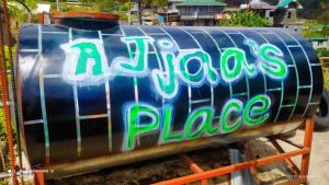 a blue barrel with a sign that reads rios blue at AJjaa's Place in Sagada