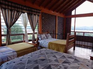 Ένα ή περισσότερα κρεβάτια σε δωμάτιο στο Casa De Los Colores