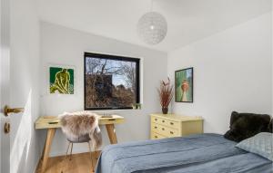 a bedroom with a bed and a desk at Stunning Home In Kalundborg With House Sea View in Kalundborg