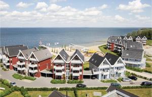 an aerial view of a beach with houses and the ocean at Cozy Apartment In Rechlin With Sauna in Rechlin