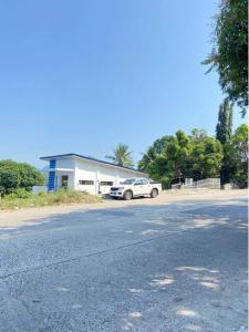 a white car parked in front of a house at The Mansion - Olongapo in Olongapo