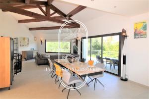 A seating area at Villa l'Arbanaise vue mer piscine presqu'Ile Giens BY HC