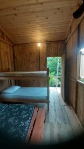 Ένα ή περισσότερα κρεβάτια σε δωμάτιο στο Cabana Toca da Serra PETAR