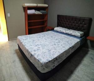 a bed sitting in a bedroom with a mattressvisor at Complejo EQUE PORA in Federación +20 photos